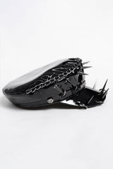 Side view of faux leather military style hat with chain detail