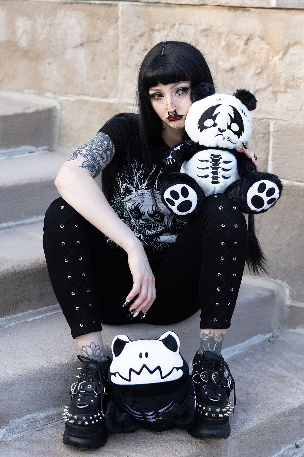 Model with VampireFreaks heavy metal panda and skeletoad plushies