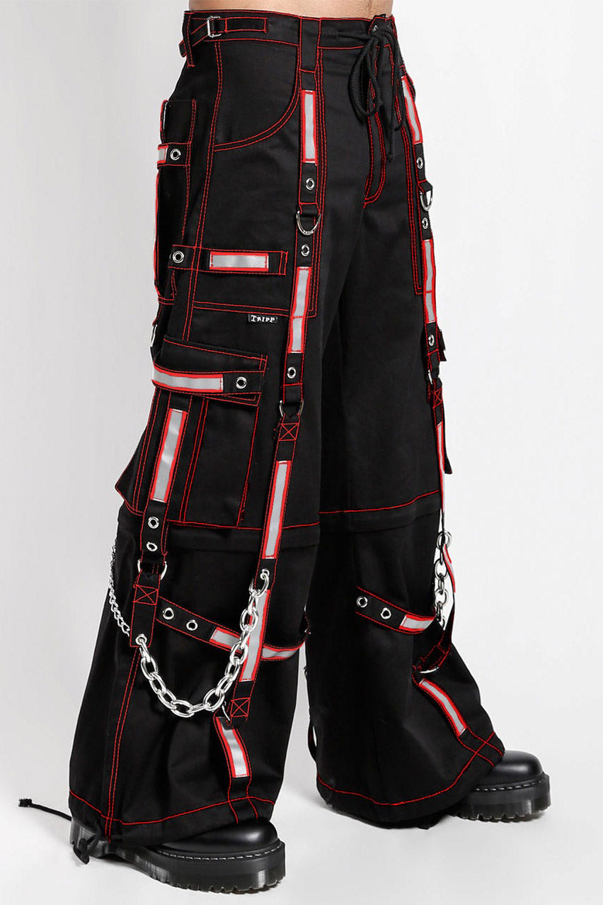 Black pants with red accents and chains on a white background