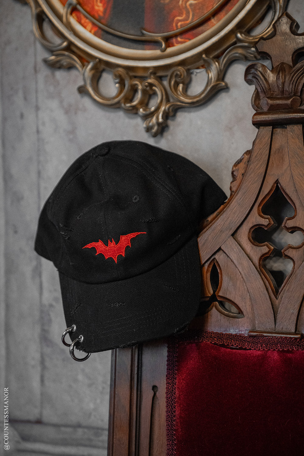 street goth baseball hat with a red embroidered at