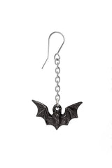 Bat-shaped earring on a white background