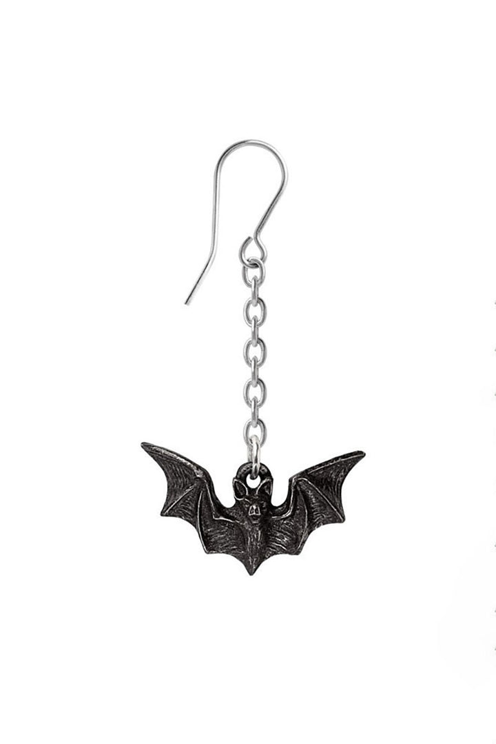 Bat-shaped earring on a white background