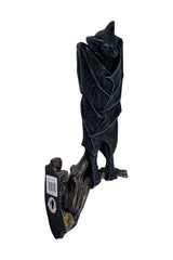 bat sleeping upside down statue