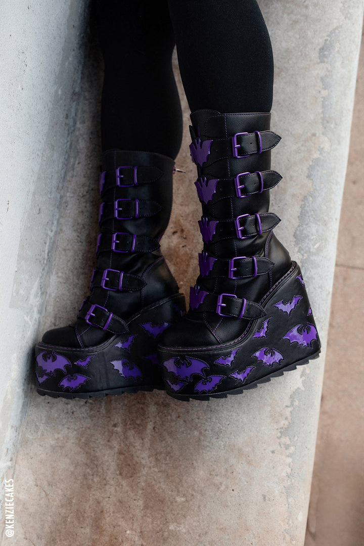 black platforms with purple bat buckles