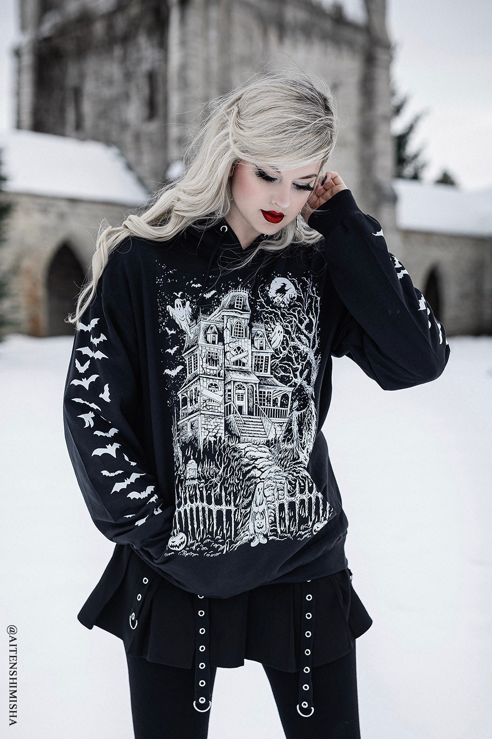 goth girl wearing haunted mansion pullover hoodie jacket