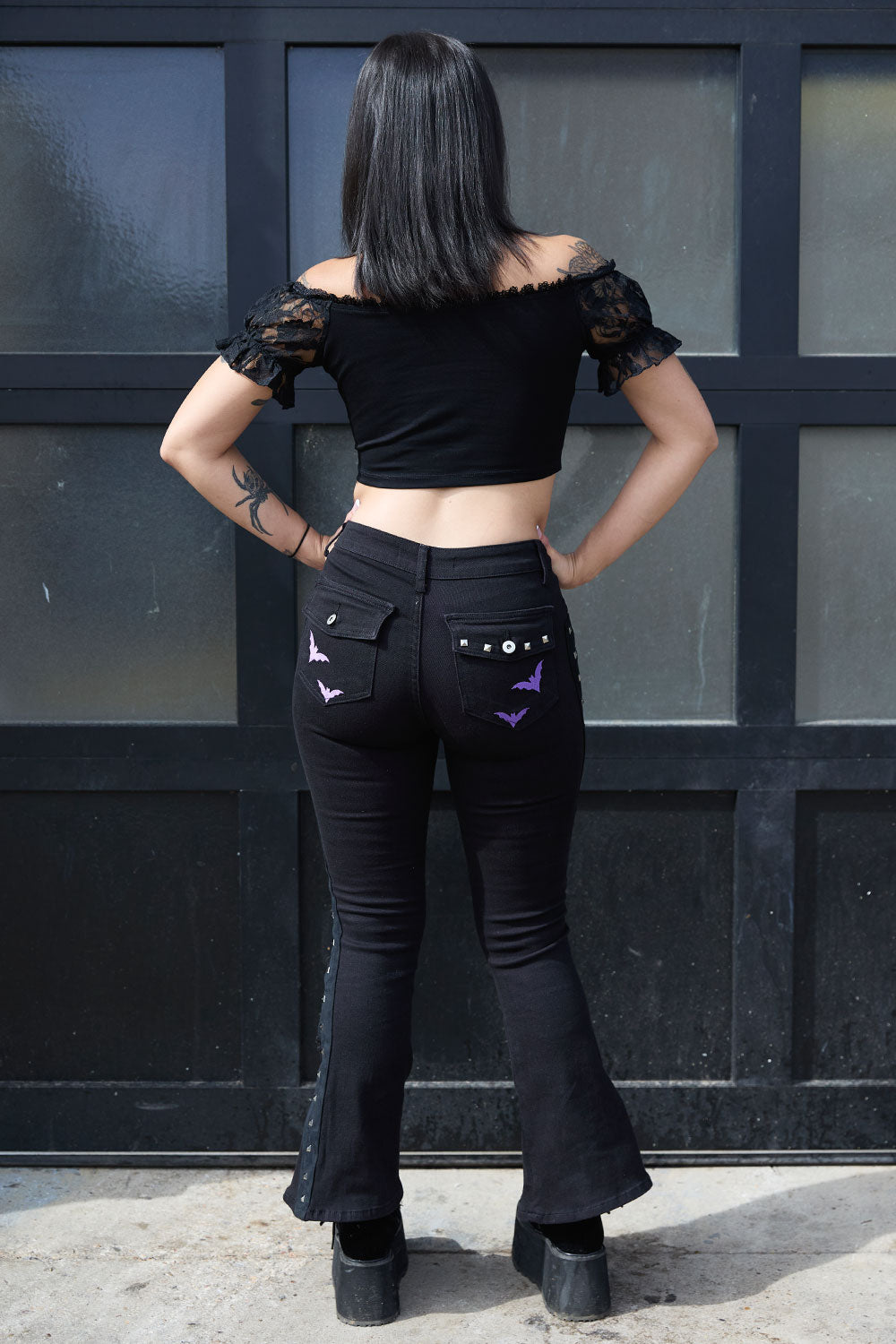 Punk black pants with embroidered purple bats on legs and back pockets