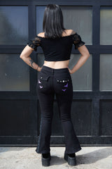 Punk black pants with embroidered purple bats on legs and back pockets