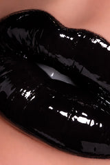 Close-up of glossy black lipgloss