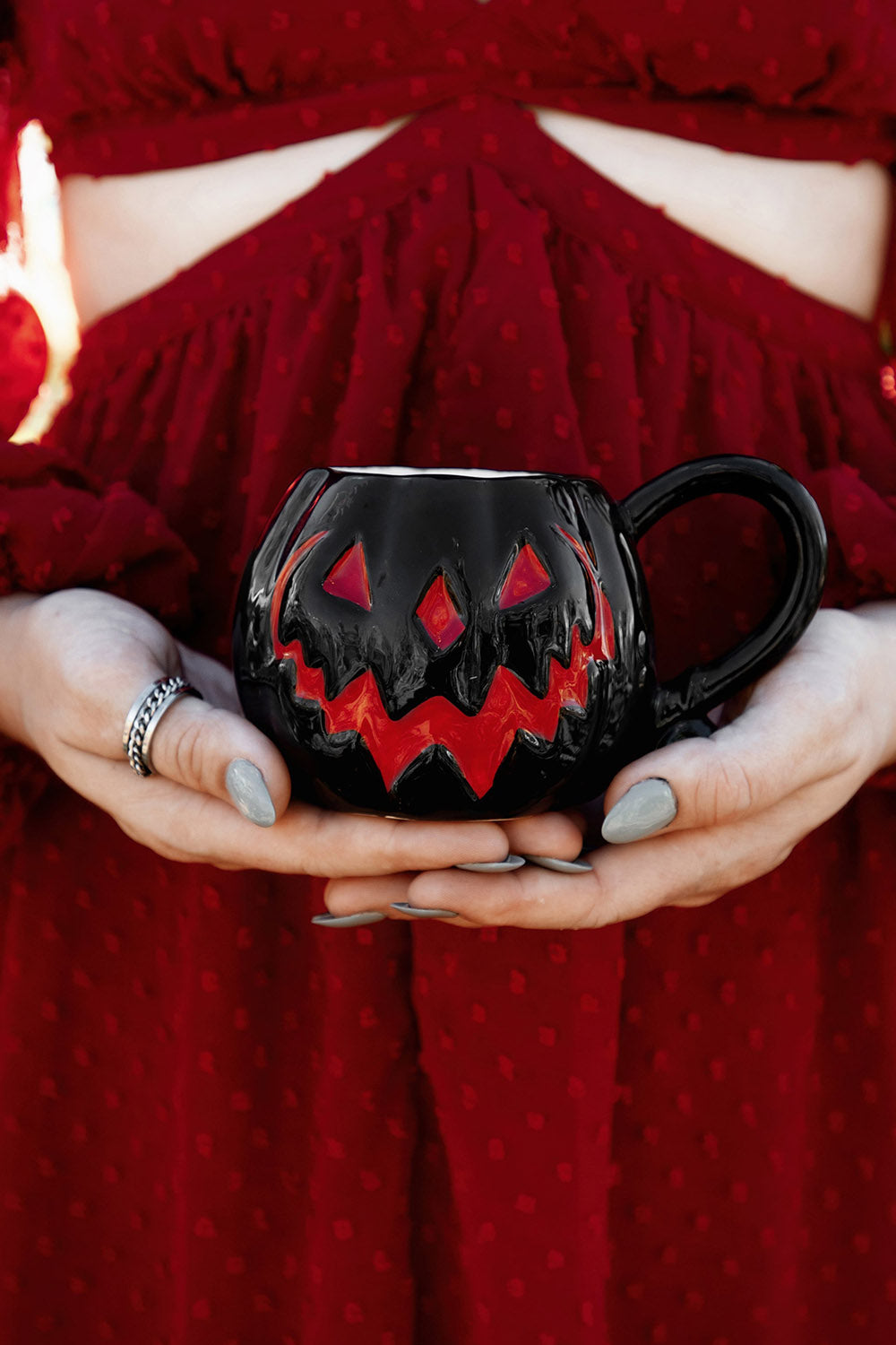 black and red ceramic jack-o-lantern mug