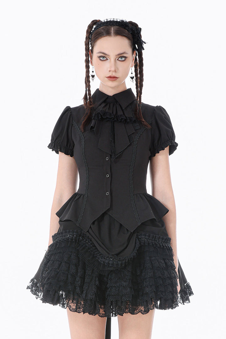 Woman wearing a black gothic-style skirt with ruffled details on a white background