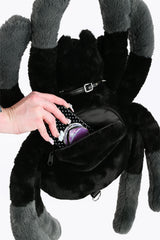 Alternative black sling backpack with spider inspired design for dark streetwear and gothic accessories
