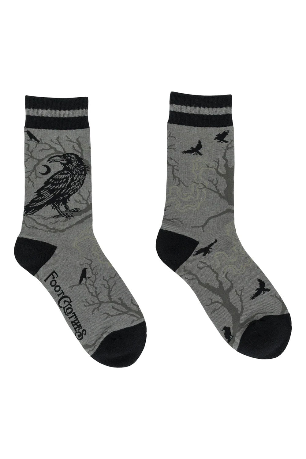 grey and black socks with crow on branch