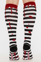 gothic black and white striped blood drip socks