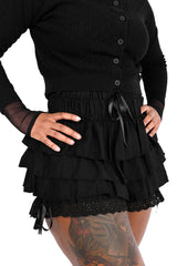 womens Black ruffled bloomer shorts with a cardigan on a white background