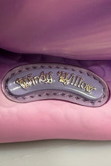 Close-up of a purple and pink snail bag with 'Windy Willow' branding.