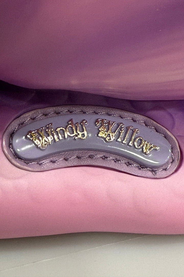 Close-up of a purple and pink snail bag with 'Windy Willow' branding.