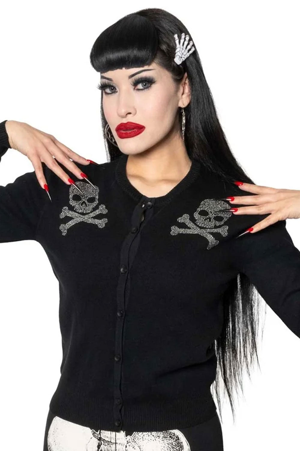 creepy knit cardigan featuring silver metal studs fashioned into a skull and crossbones design on the front and back