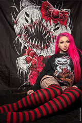 gothic woman with pink hair modeling before a heavy metal shower curtain