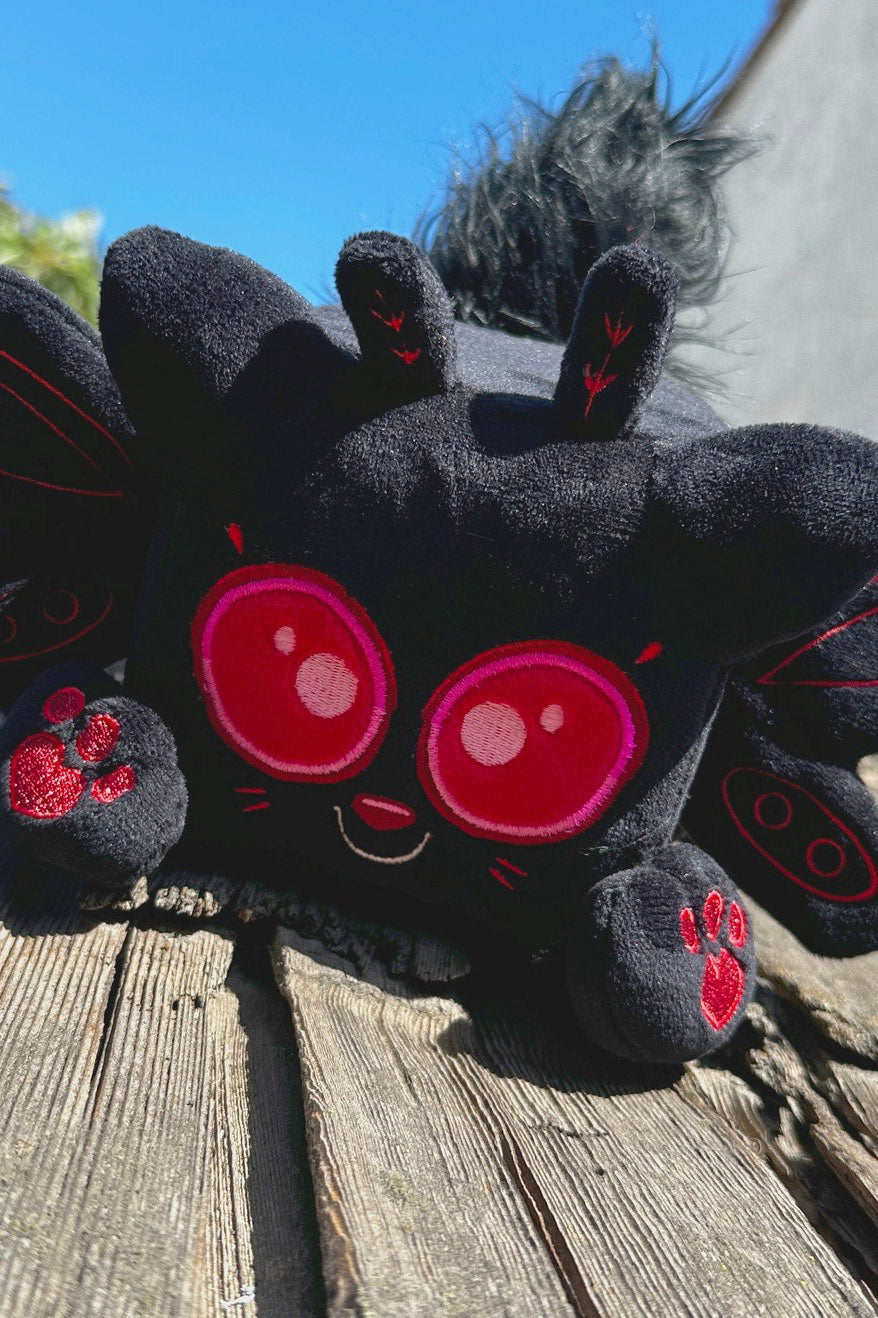 black and red creepy cute mothman plush toy