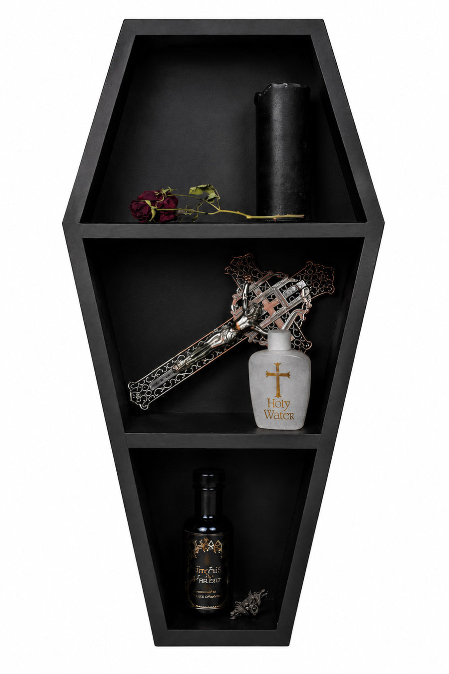 Black coffin-shaped shelf with decorative items including a bottle, cross, and rose.