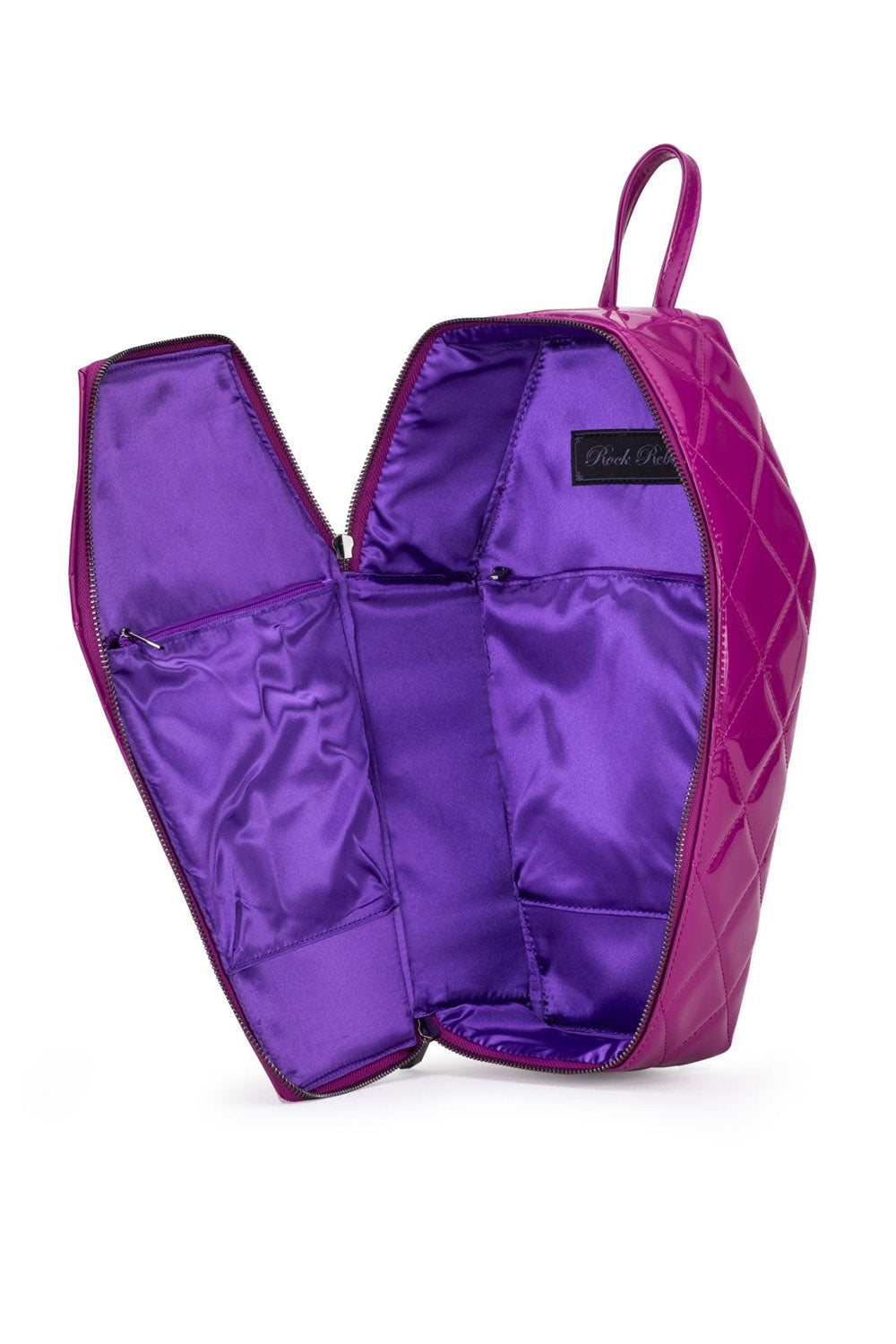 A purple quilted cosmetic bag shown open, displaying its satin purple interior pockets and a black brand label that reads 'Paul Mitchell'.