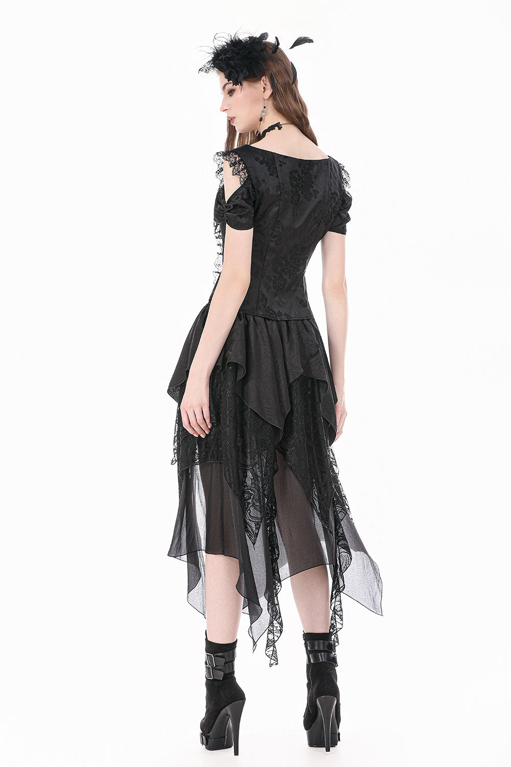 Back view of model wearing cut out shoulder black top