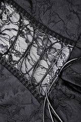 Close-up of black lace fabric with a satin border