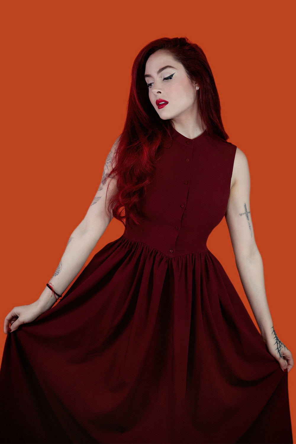 dark red sleeveless dress with pockets