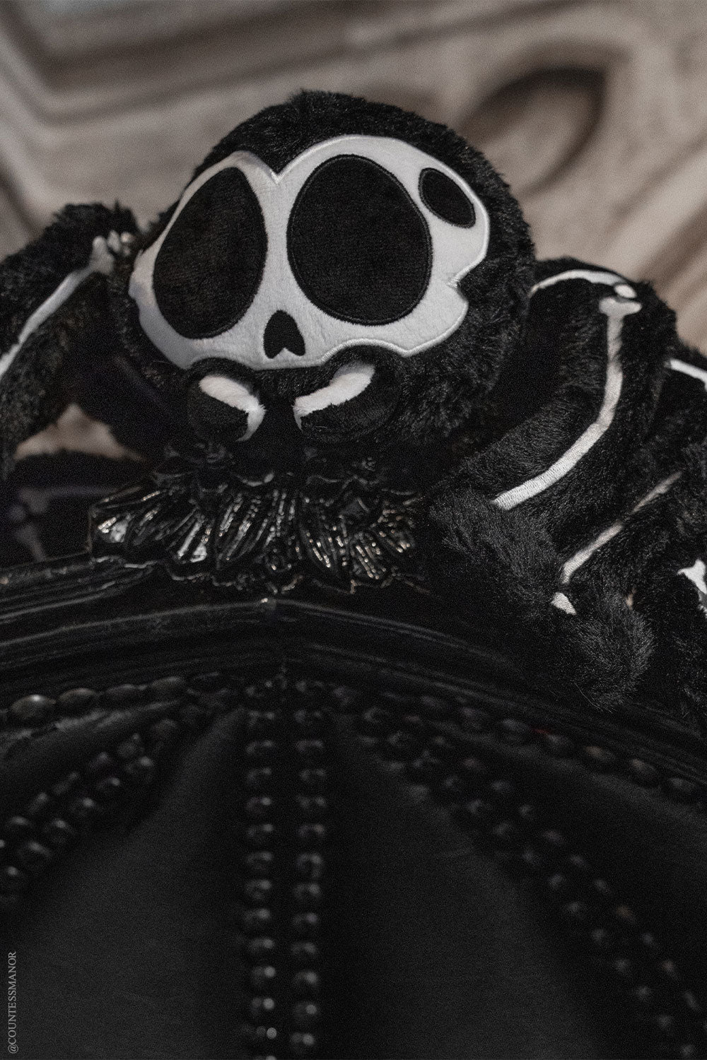 fuzzy black and white embroidered gothic skeleton black widow spider studded animal toy