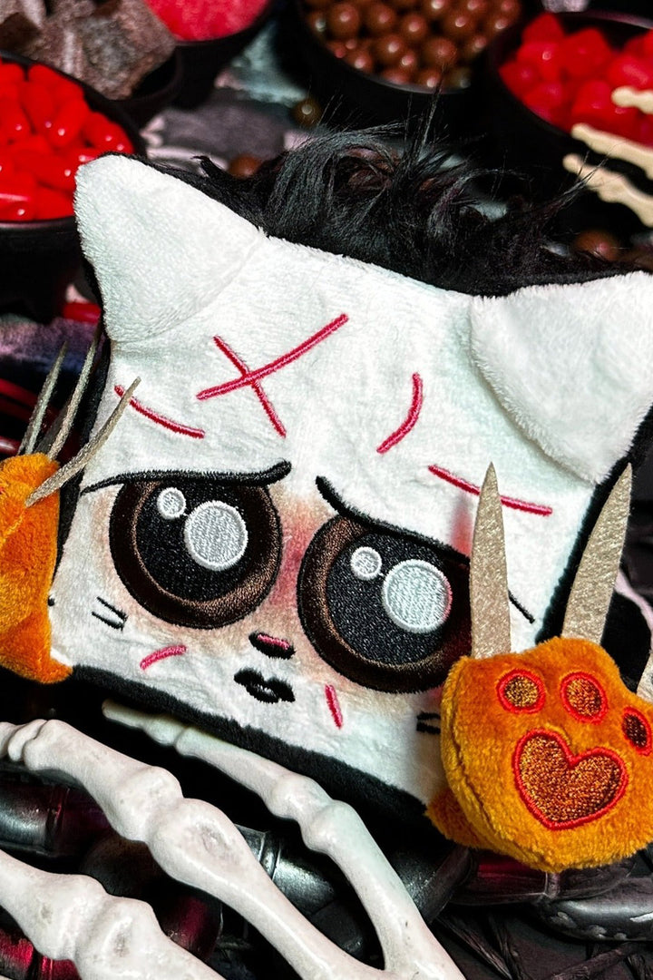 spooky cat with long claws plushie toy