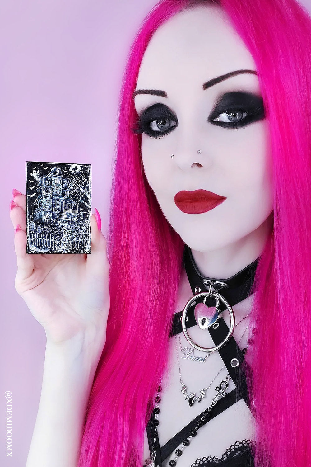 goth girl holding spooky magnet