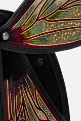 Close-up of a bag with intricate multicolored patterns on a white background