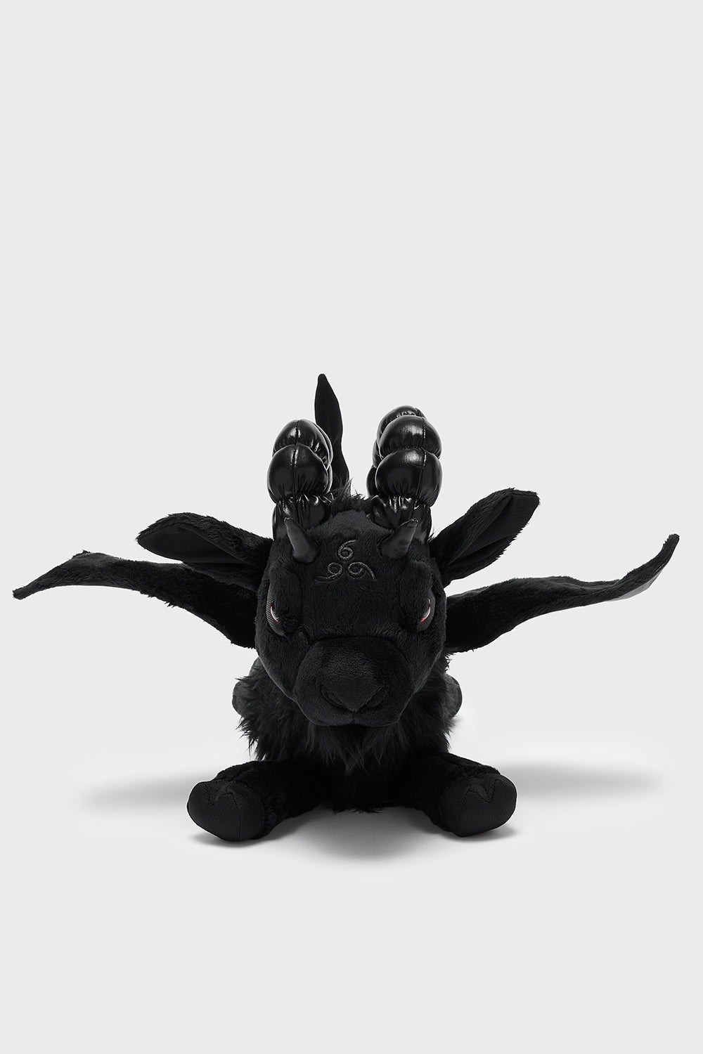 goth black goat plushie toy with red eyes 