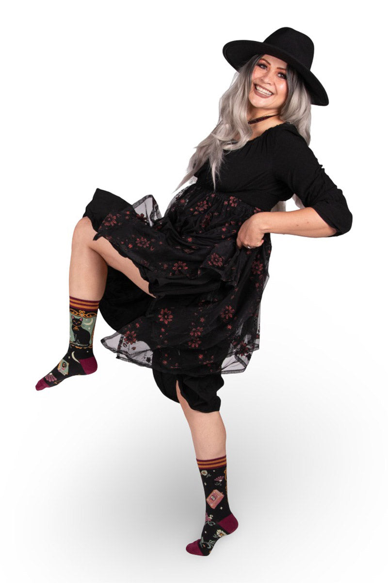 mystical black cat, spell book, moon, and flower socks