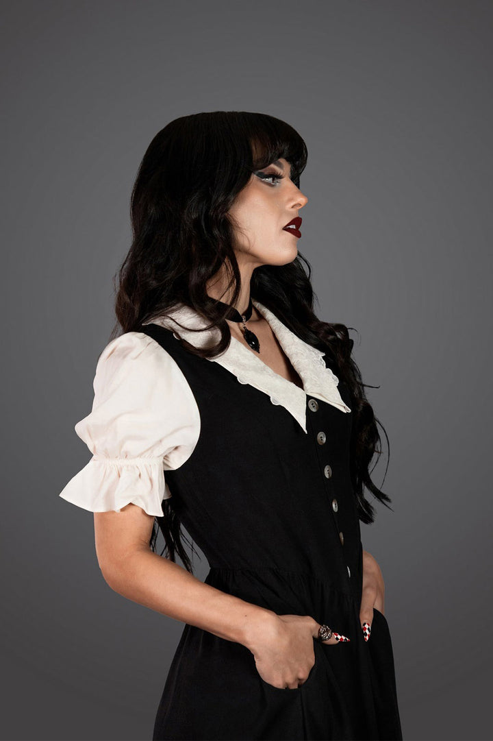 long black dress with a lace collar and buttoned front 