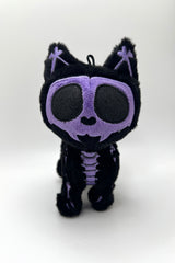 black and purple skeleton cat plushie toy 