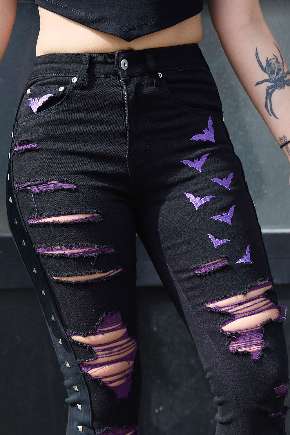 VampireFreaks womens distressed black flares with purple embroidered bats