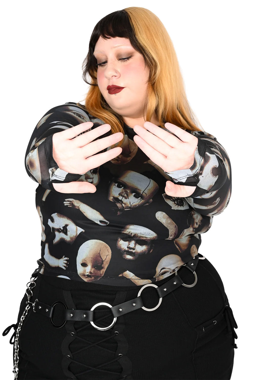 Black mesh top with broken doll parts and thumb holes