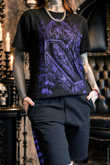 black sweat shorts with purple flying backs graphics on the side