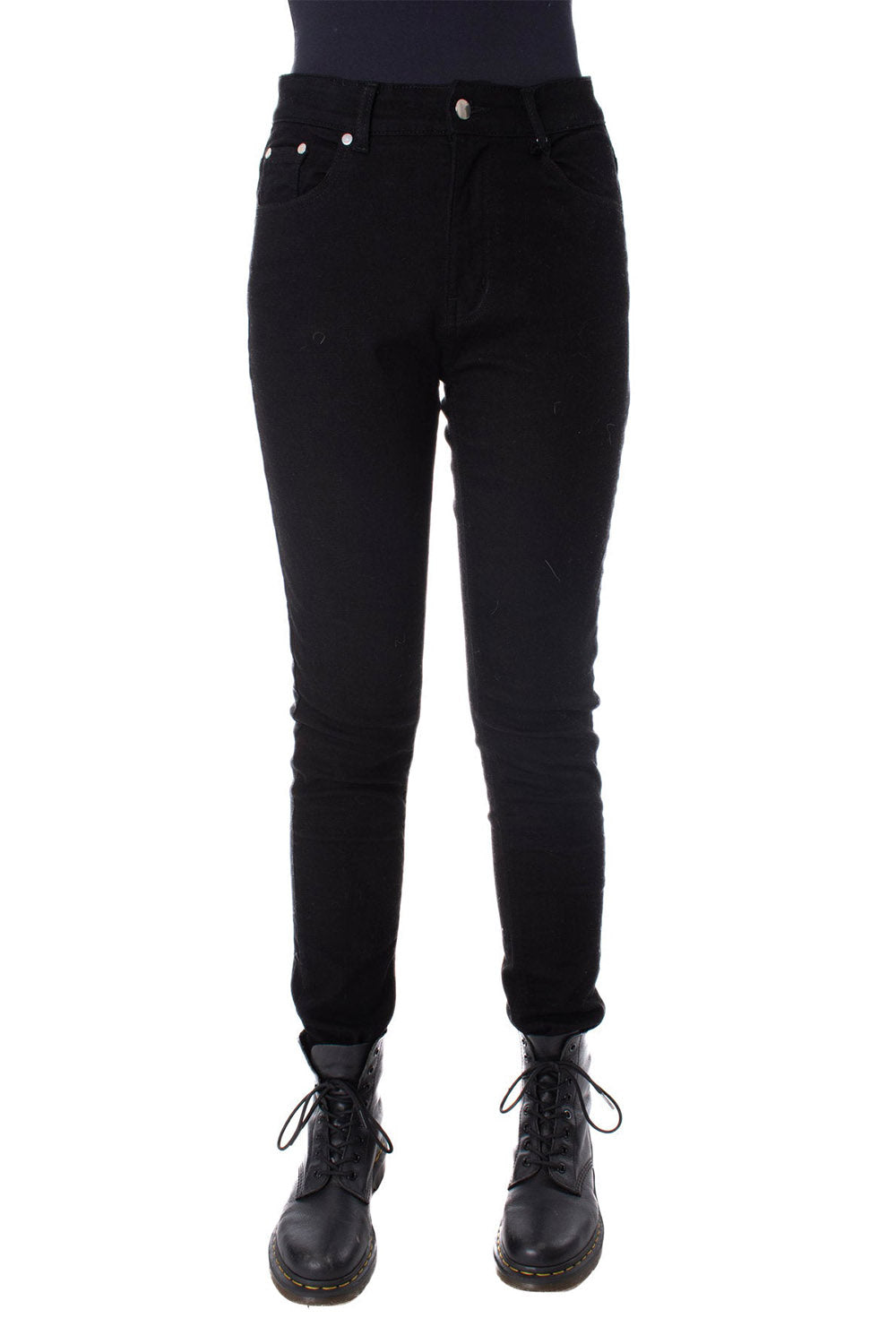 Black pants worn by a person on a white background