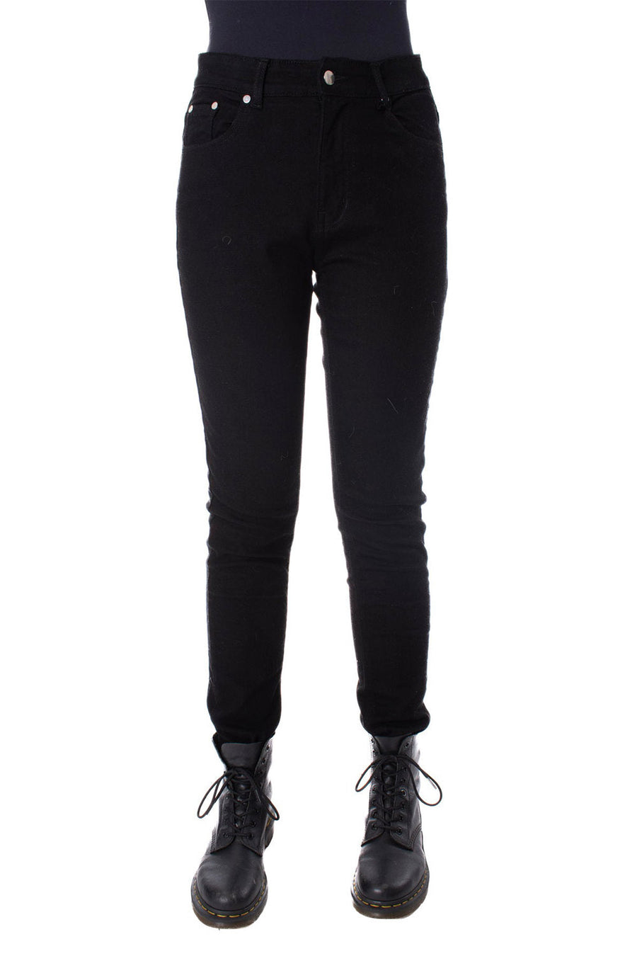 Black pants worn by a person on a white background