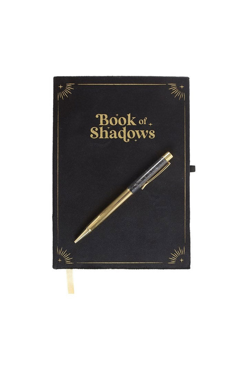 occult notebook with obsidian pen