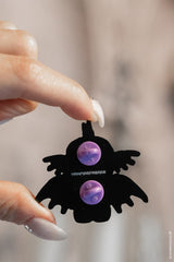 sea monster enamel pin with purple back button close