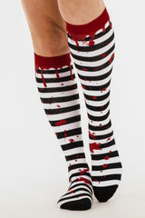 spooky horror black and white striped blood drip socks