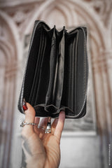 inside a gothic crow vegan leather wallet with wristlet strap and coin purse