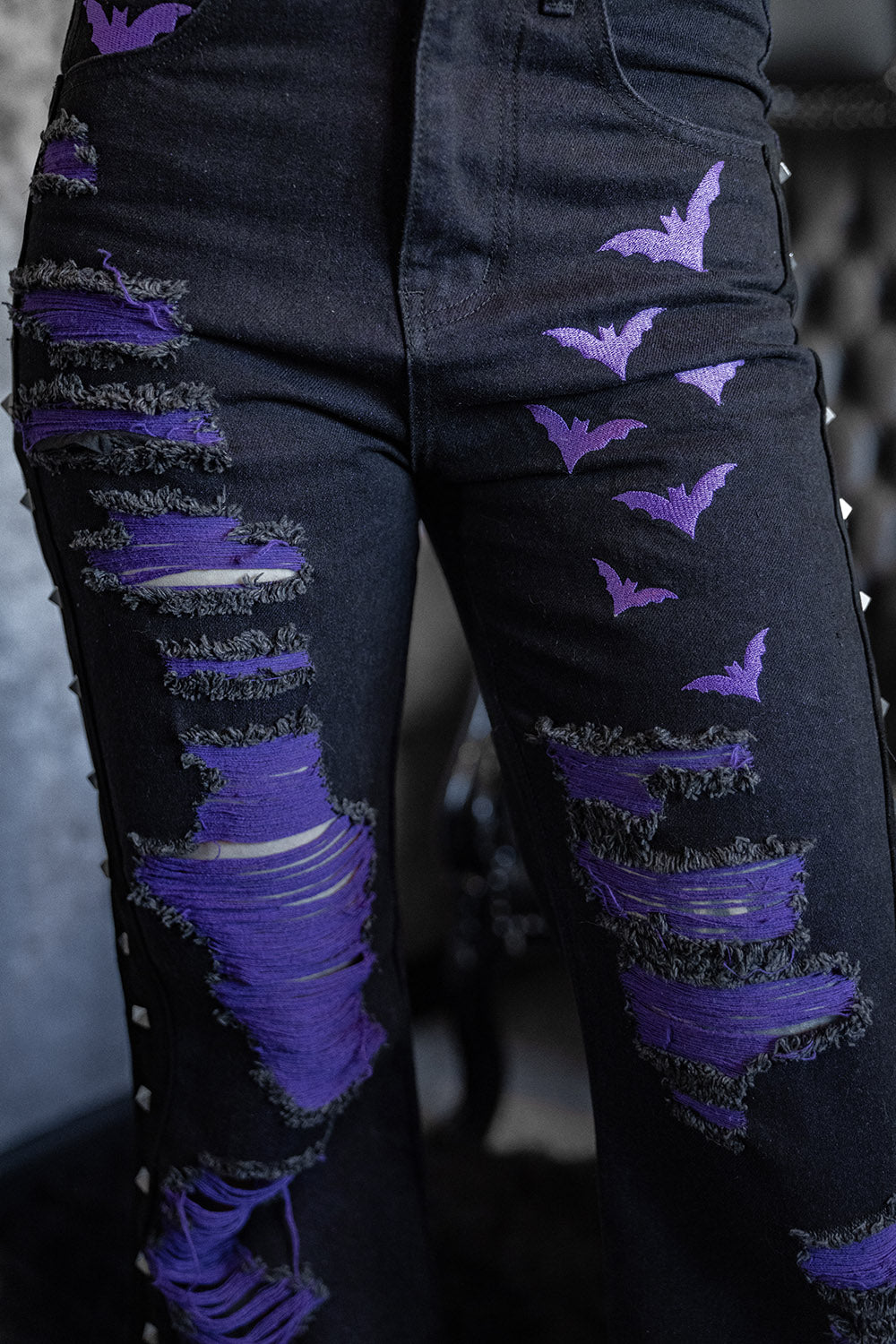 womens gothic cargo denim jeans with shredded details and bats 