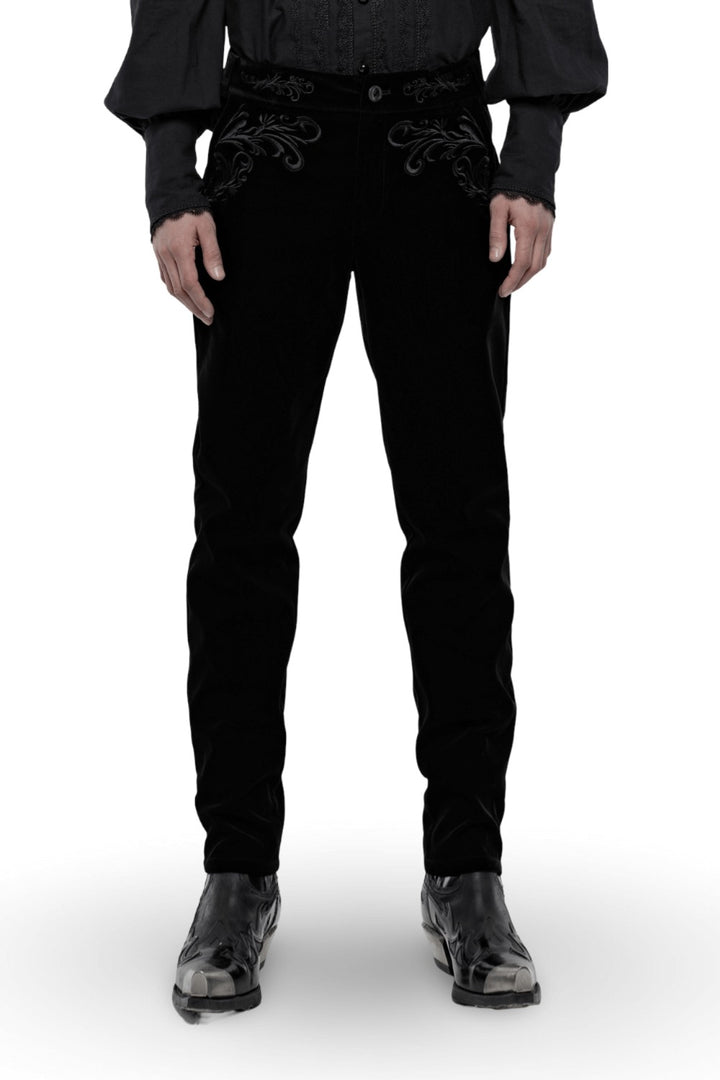 Black pants with intricate designs on a white background