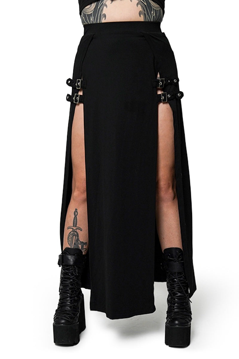 Black high-slit skirt with belt and black boots on a white background