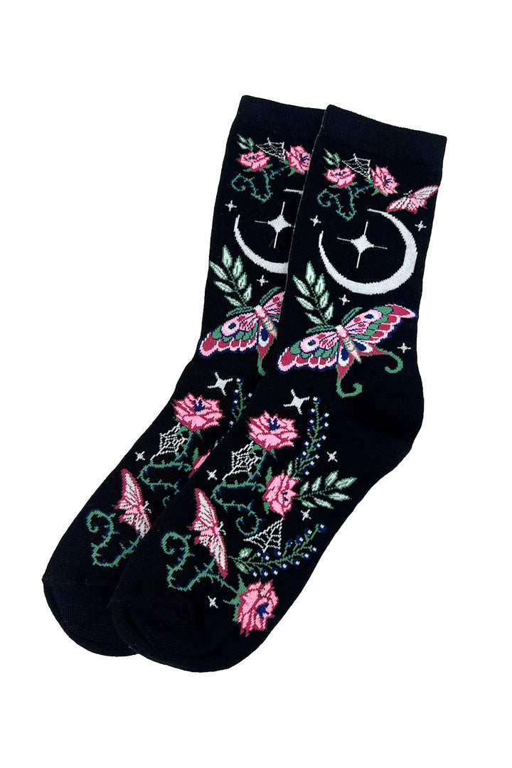 Black socks with floral and moon designs on a white background