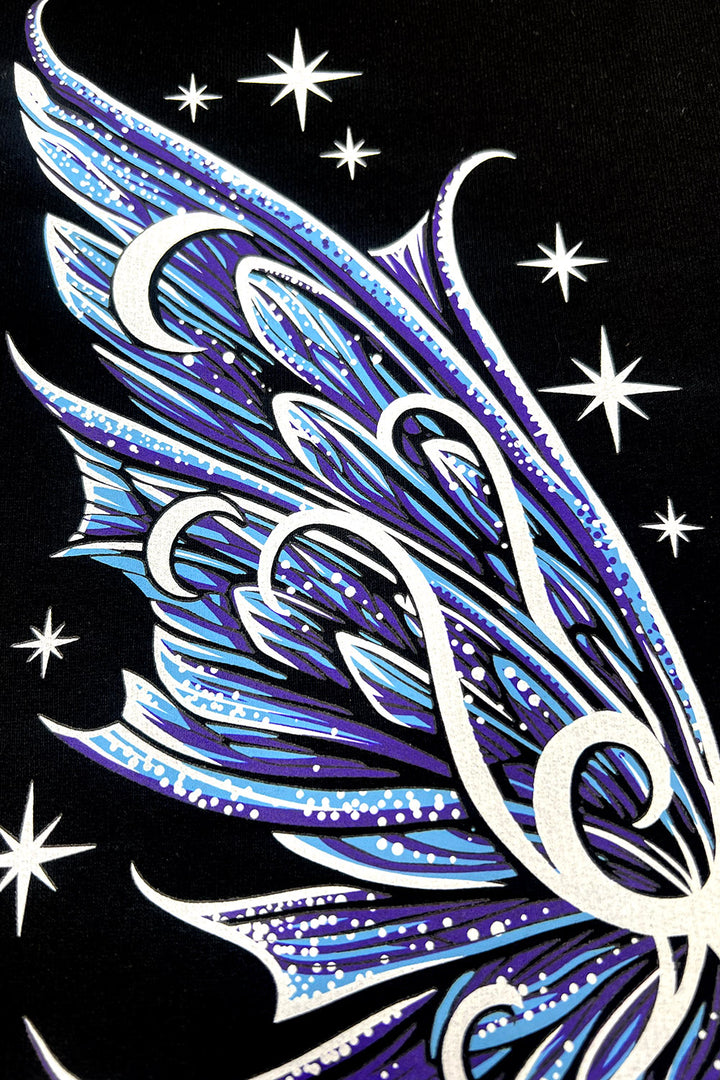 fairycore blue, purple, and white moth wings printed on the back of a sweatshirt